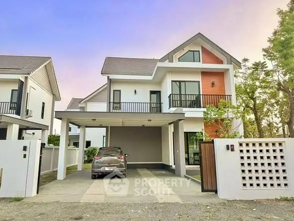 Modern two-story house with carport and stylish facade at sunset