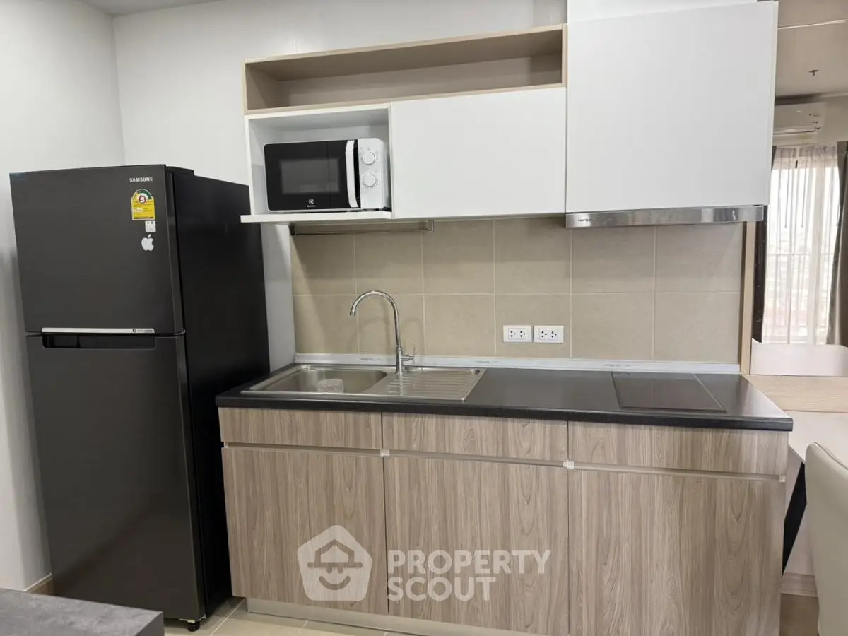 Modern kitchen with sleek cabinetry, stainless steel appliances, and ample counter space.