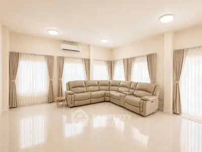 Spacious living room with elegant corner sofa and natural light