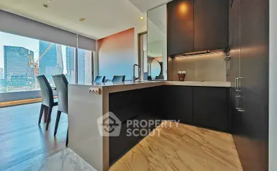 Luxurious modern kitchen with open layout and stunning city view