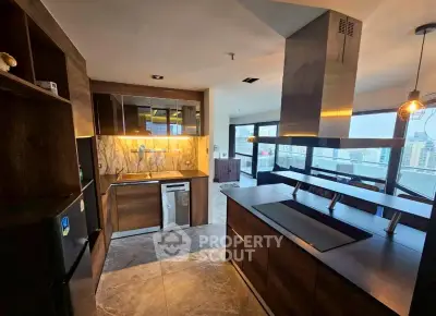Modern kitchen with sleek design and city view, featuring open layout and high-end appliances.
