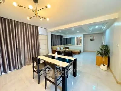 Spacious modern living room with elegant dining area and stylish lighting