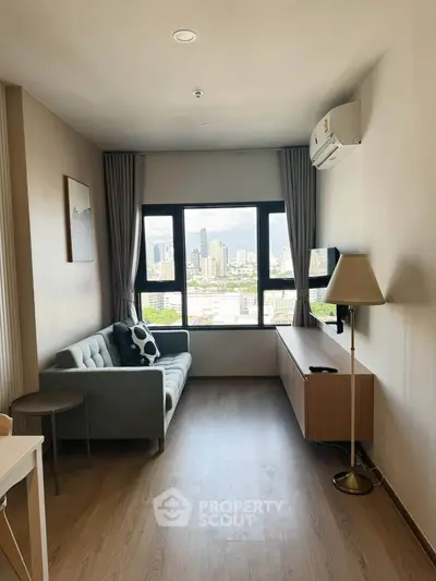 Modern living room with city view, featuring a cozy sofa, stylish decor, and large windows.