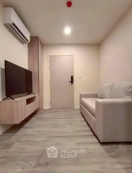 Modern minimalist living room with sleek furniture and air conditioning