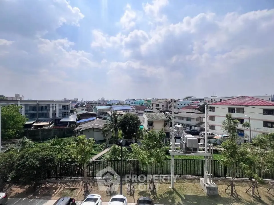 Scenic view of suburban neighborhood with lush greenery and clear blue sky.