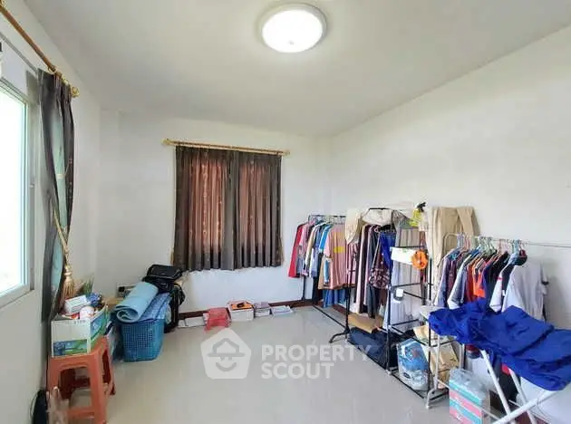 Spacious room with natural light, ideal for storage or creative space.