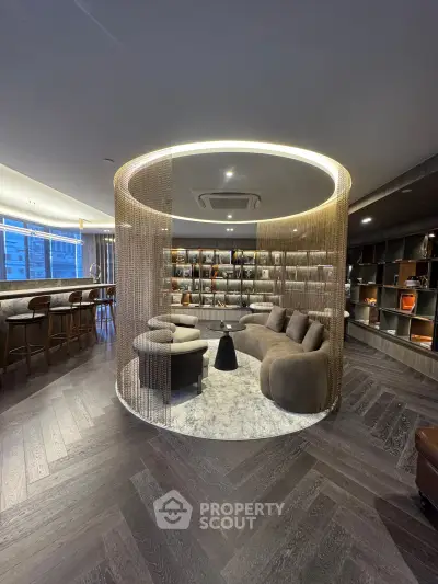 Luxurious modern living room with unique circular seating area and elegant lighting, perfect for relaxation and entertainment.