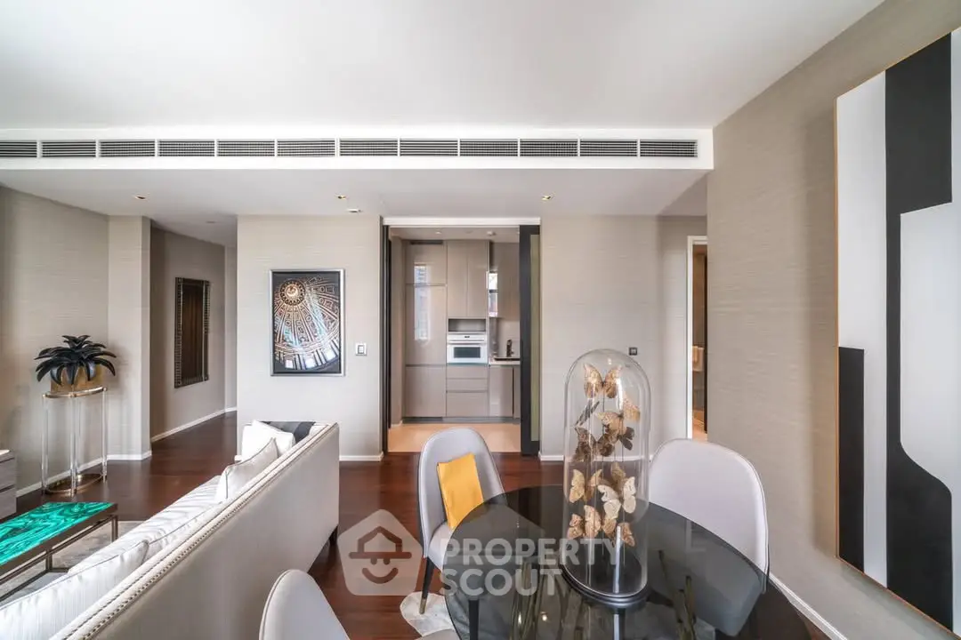 Luxurious modern living room with elegant decor and open kitchen layout, perfect for stylish urban living.