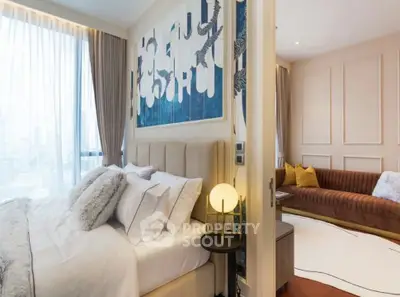 Luxurious modern bedroom with elegant decor and cozy living area, perfect for urban living.