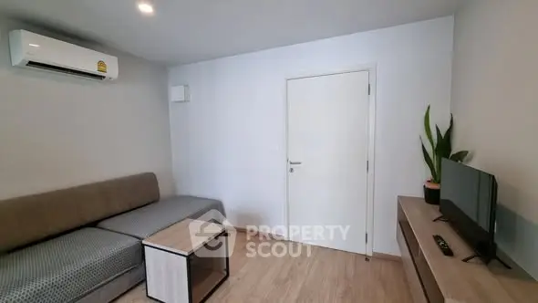 Modern living room with air conditioning and sleek furniture