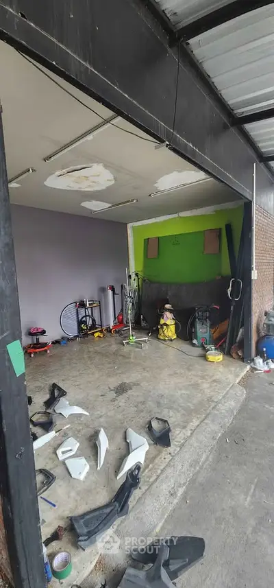 Spacious garage with ample storage potential and versatile workspace.