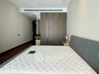 Modern bedroom with sleek design and ample storage space