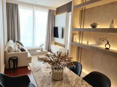 Modern living room with elegant decor and large windows offering city views.