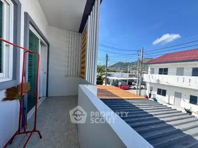 Spacious balcony with scenic view in modern residential area, perfect for relaxation and outdoor enjoyment.