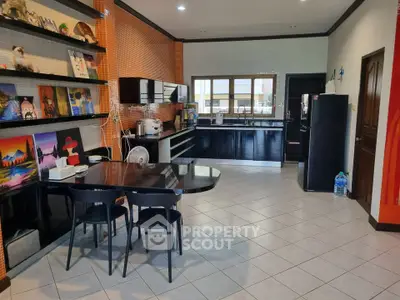 Spacious kitchen with modern black cabinets and open layout