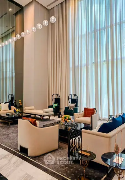 Luxurious modern living room with high ceilings and elegant decor in a sophisticated apartment.