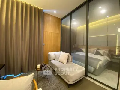 Luxurious bedroom with elegant decor and cozy seating area, featuring modern design and ambient lighting.