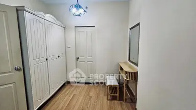 Spacious bedroom with elegant wardrobe and vanity set in modern home