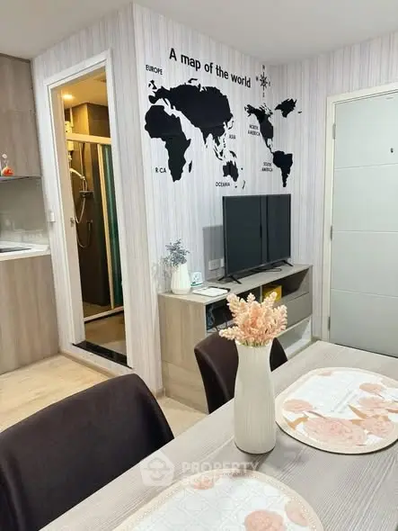Modern living room with world map wall art and open kitchen layout