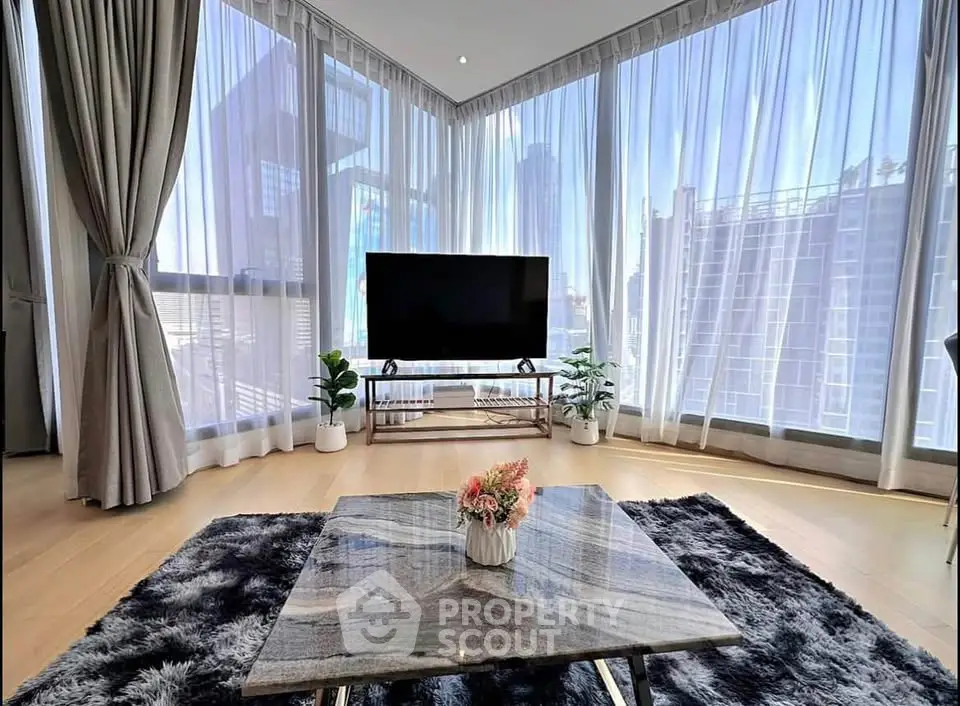 Luxurious corner unit living room with floor-to-ceiling windows and stunning city views.