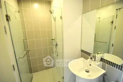 Modern bathroom with glass shower and sleek sink design