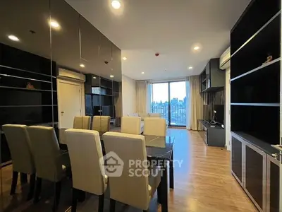Spacious modern living room with city view and elegant dining area