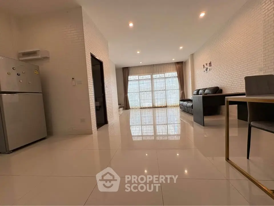 Spacious modern living room with sleek design and ample natural light