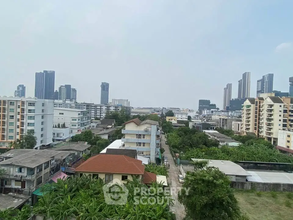 Stunning cityscape view showcasing diverse architecture and lush greenery, perfect for urban living enthusiasts.