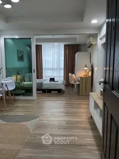 Modern open-plan apartment with stylish decor and natural light