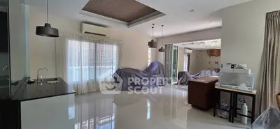 Spacious modern living room with sleek design and ample natural light