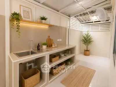 Charming minimalist kitchen with open shelving and natural light