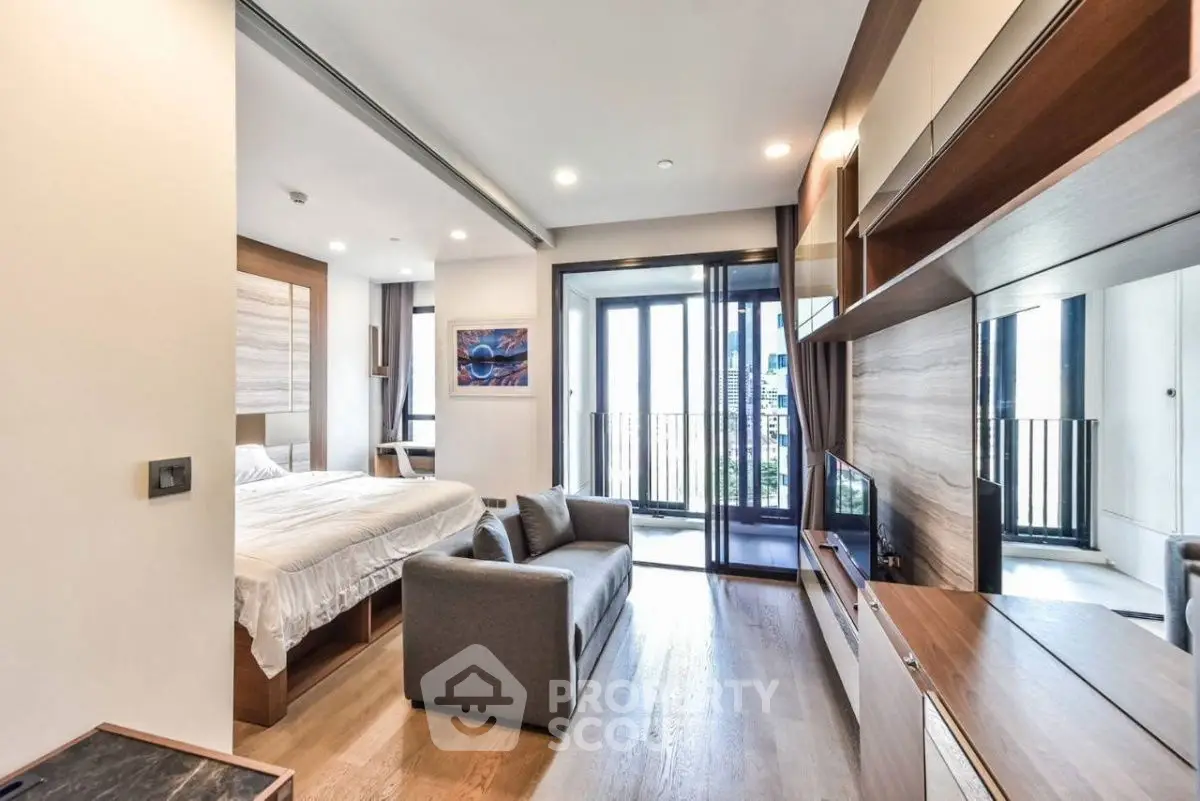 Modern studio apartment with open layout and balcony view