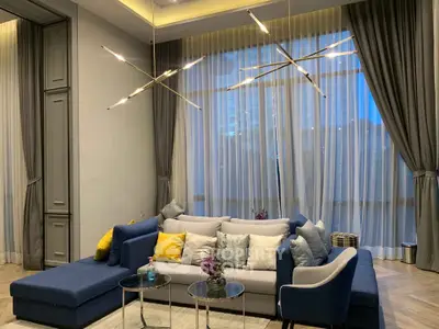 Luxurious living room with modern lighting and elegant curtains