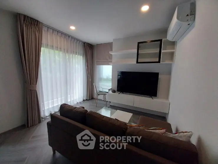 Modern living room with sleek design and wall-mounted TV