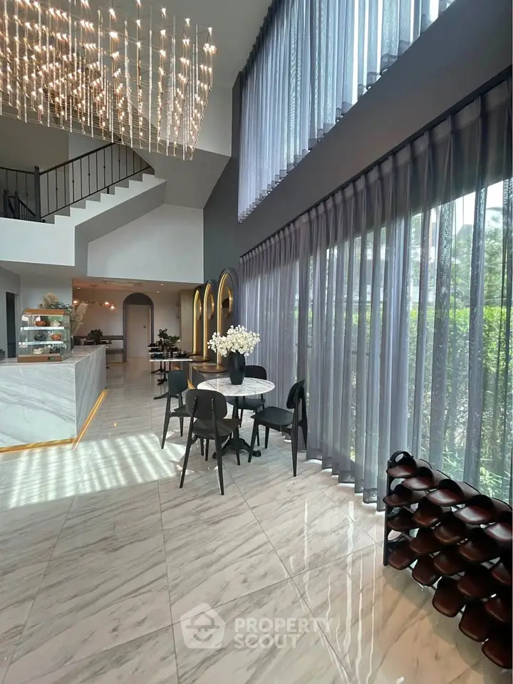 Luxurious modern living room with high ceilings and elegant decor