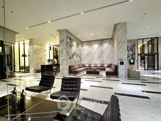 Luxurious modern lobby with marble floors and elegant seating area