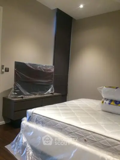 Modern bedroom with new furniture and sleek design, perfect for urban living.