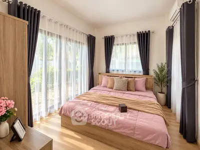 Spacious bedroom with large windows and elegant curtains, featuring a cozy bed and stylish decor.