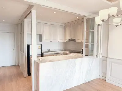 Elegant kitchen with marble countertop and open layout in modern apartment