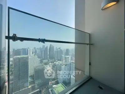 Stunning high-rise balcony with panoramic city skyline view, perfect for urban living enthusiasts.