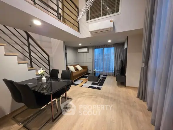 Modern duplex living room with stylish decor and open layout