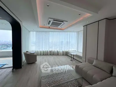 Luxurious modern living room with panoramic city view and elegant furnishings