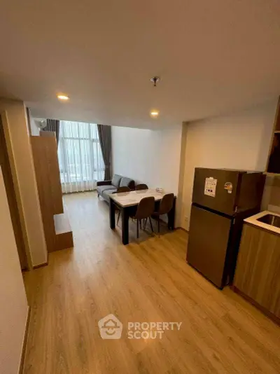 Modern living room with dining area and kitchen in open layout apartment