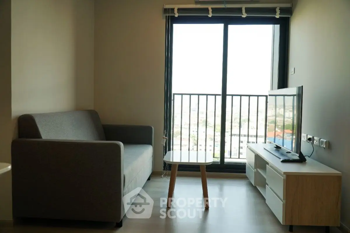 Modern living room with balcony view and stylish furniture