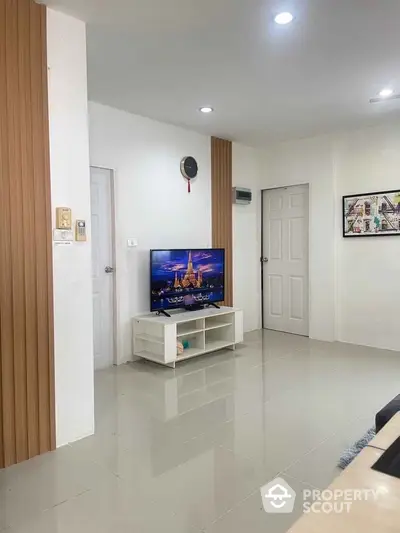 Modern living room with sleek TV setup and minimalist decor