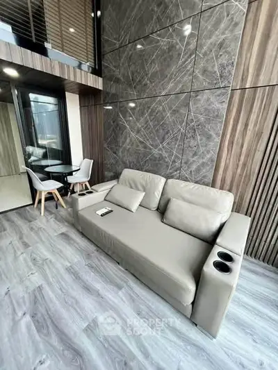 Modern living room with stylish sofa and elegant decor in a contemporary apartment.