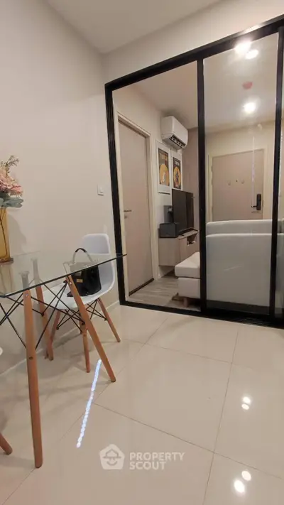 Modern apartment interior with glass partition and stylish furniture