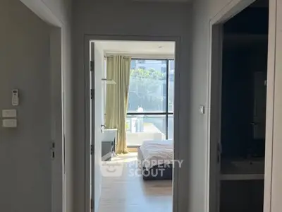 Bright bedroom with large window and modern decor