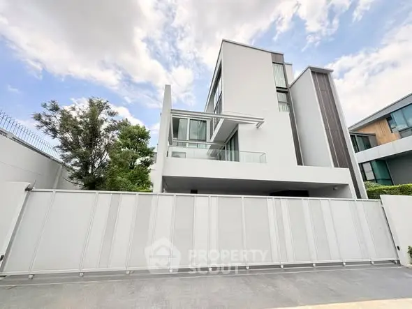 Modern luxury home exterior with sleek design and large windows, showcasing contemporary architecture.