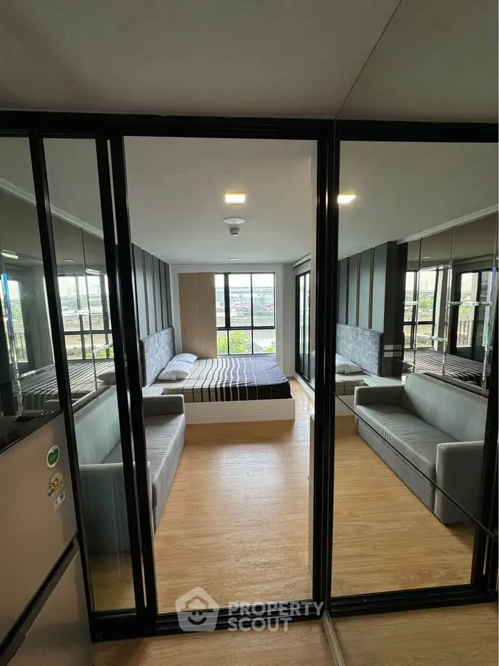 Modern bedroom with glass walls and stylish decor in urban apartment